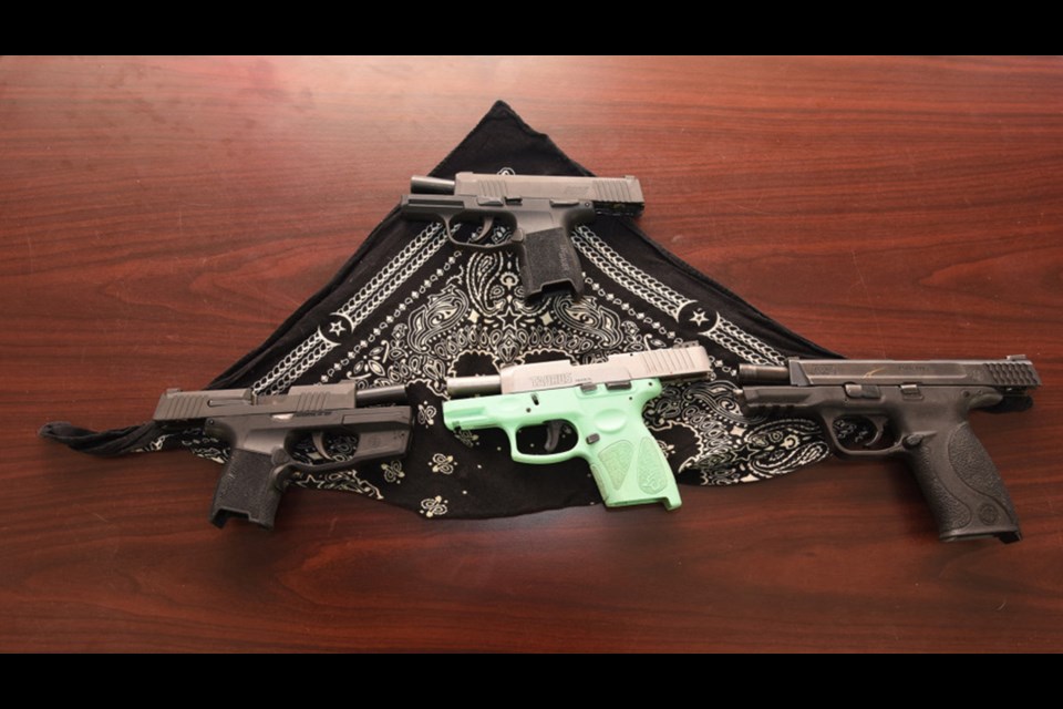 Street gang members have certain colours they use in the paisley bandanas that they wear.  RCMP seized the firearms in their investigation into the drug operation. 