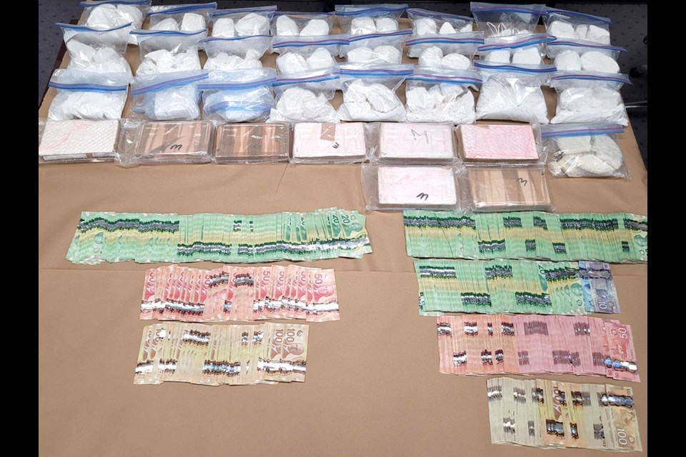 Police seized 31 kilograms of Cocaine, $55,000 in cash, gun parts and ammunition, Cocaine cutting agent, and paraphernalia consistent with a large-scale drug trafficking operation.