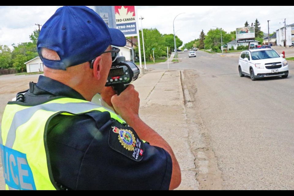 Const. Stan Koch of the Moose Jaw Police Service aimed a radar gun up Government Road on Wednesday to monitor for any speeders during the STEP program in Weyburn