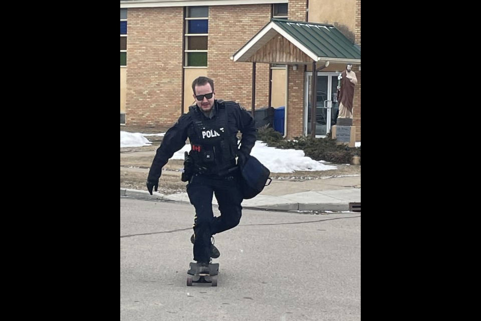 Cst. Clayton Sawatsky skateboards to the detachment along the streets of Canora.