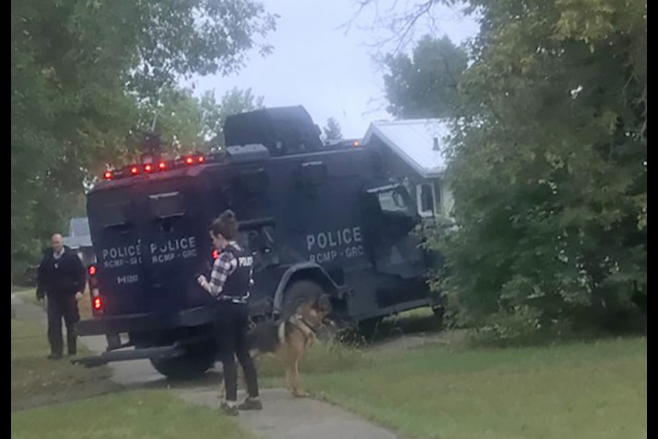 An RCMP tactical unit and police dog at 708 Herkimer Street in Rosetown. There were also numerous marked RCMP vehicles at the back of the house, along the side and front on Aug. 23. 