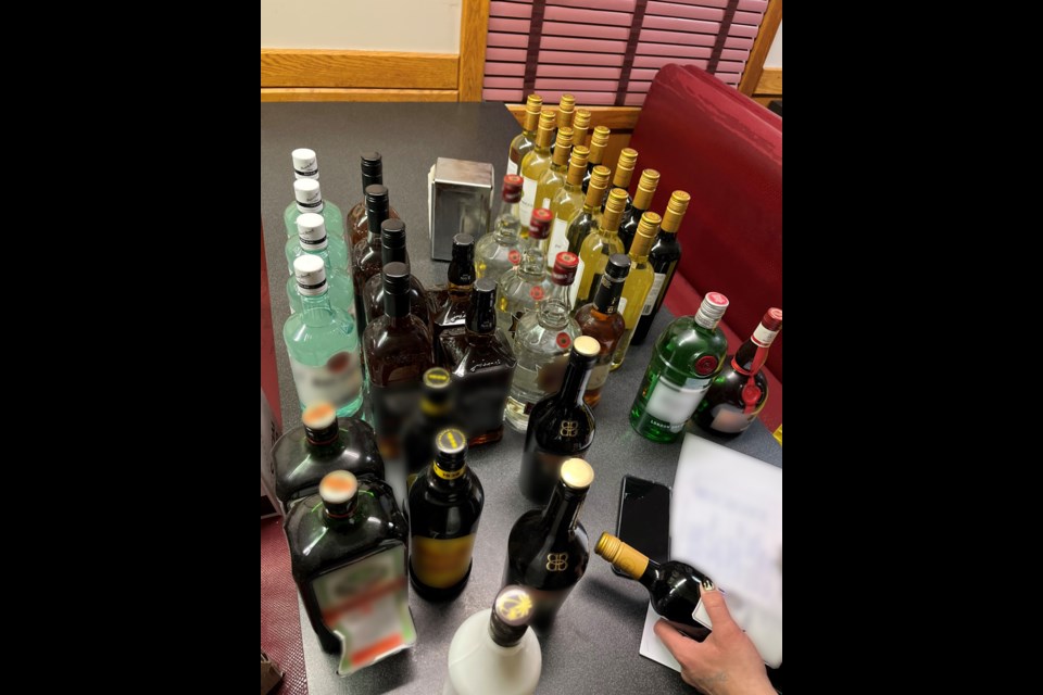 24 bottles of hard liquor were among the items found in a search.