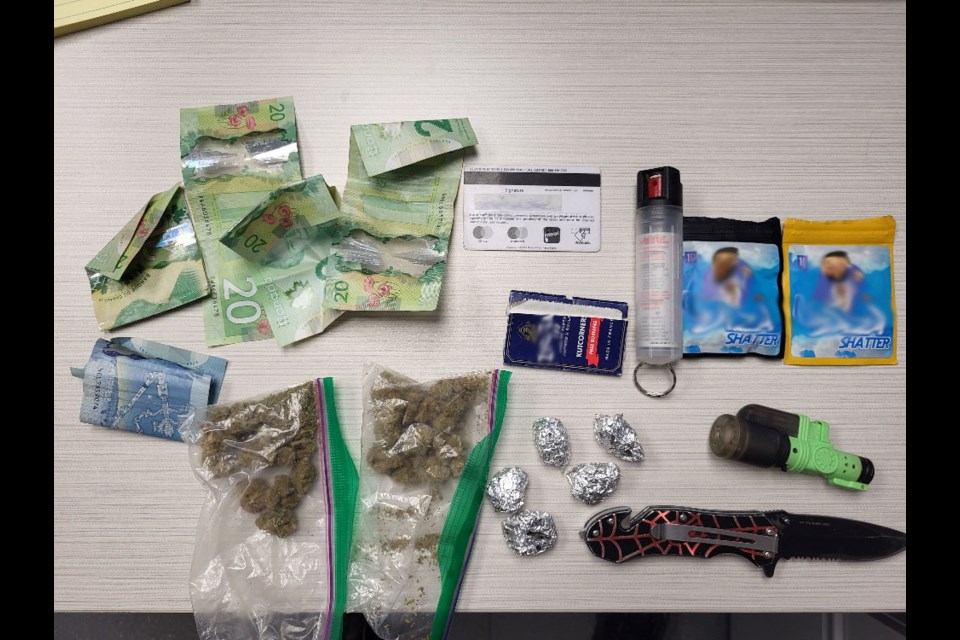 Officers located and seized about 43 grams of crack cocaine, 52 grams of methamphetamine, bear spray, brass knuckles, an imitation pistol, drug trafficking paraphernalia, and a sum of cash in the vehicle.