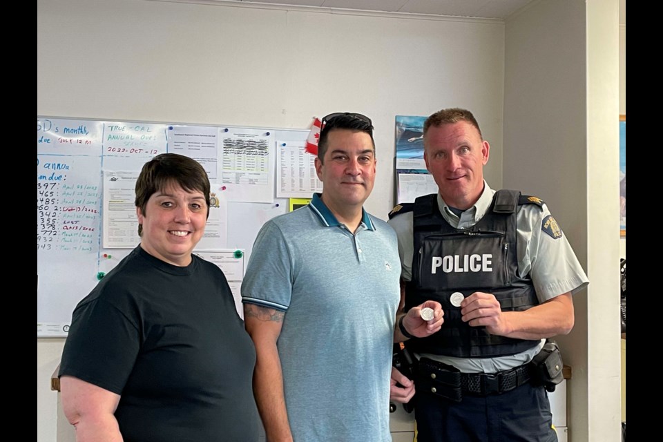 Connie Hagel with the local MADD chapter presents Van de Vorst Family Awards to RCMP Const. Adrian Boal, middle, and Staff Sgt. Douglas McDougall, right. 