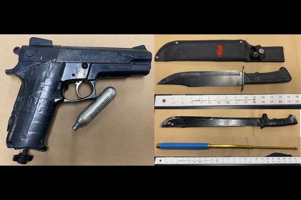 The backpack was located nearby and contained a handgun, a hunting knife and an expandable baton. During the foot chase officers observed him discard the machete in a garbage bin.