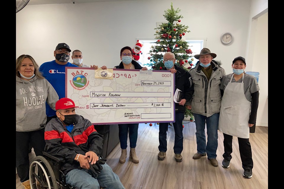 The donation to the Lighthouse shelter operated by BATC. Seen here : Darren Castor (sitting)
Left to right: Sandy Cardinal, Warren Favel, Carl Nieviadomy, Sonia Gardypie (farthest right) and from Kiwanis: John Hunchak (third from right and Jim West (second from right).