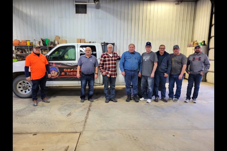 South East Sask. Search and Rescue volunteer and RM of Lomond employee Clarence Fradette, left, received the donation of the truck from RM councillors, from left, John Tosczak, Denis Sidloski, Reeve Desmond McKenzie, Brad Irwin, Fred Morrice, Todd Persson and Blake McLeod. 