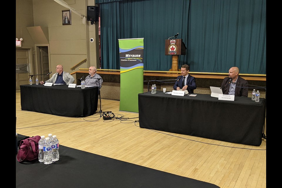 Candidates Larry Heggs, Dana Pretzer, Trevor Tessier and Brandon Tichkowsky answer questions posed by the Weyburn Chamber of Commerce.