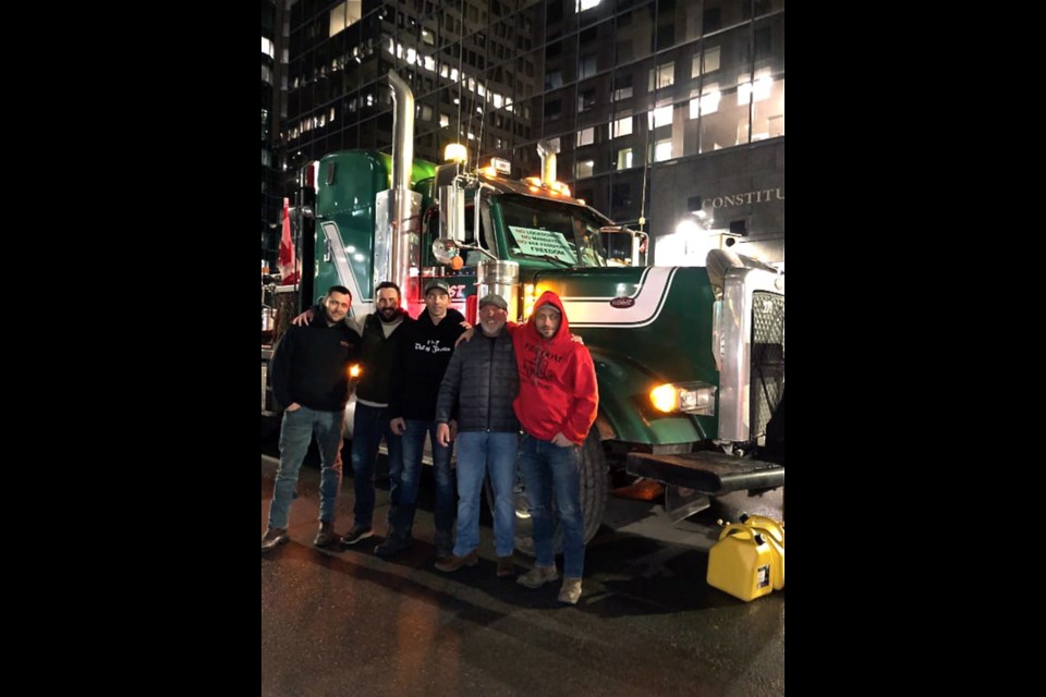 Carievale's Riley Carpenter, left, Ken Hilton, middle, and Cody Gliddon of Prairie Boys Spray Foam out of Regina, right, participating in convoy in Ottawa. They were joined by Hilton's boss Dennis Day of Fast Trucking, second from the right and a friend during their visit to the capital. 