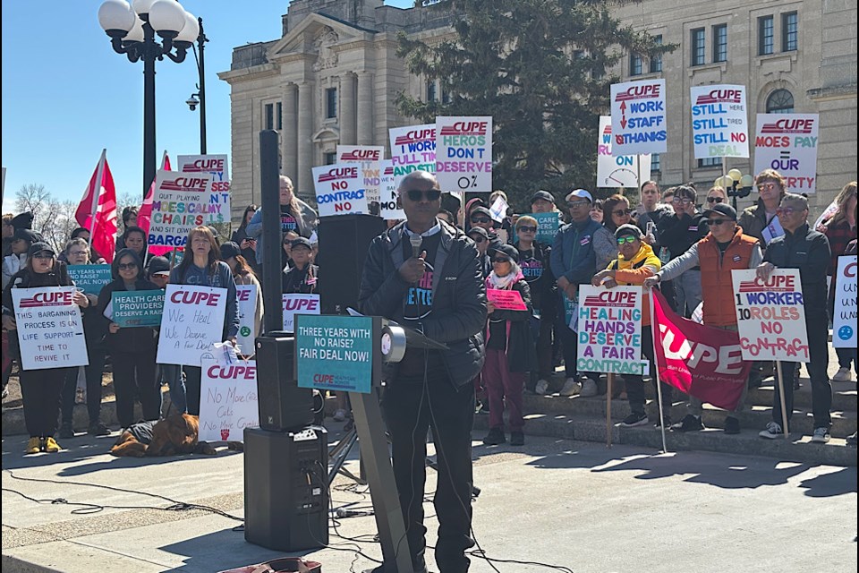 Bashir Jalloh, head of CUPE 5430, speaks to rally at the Legislature.