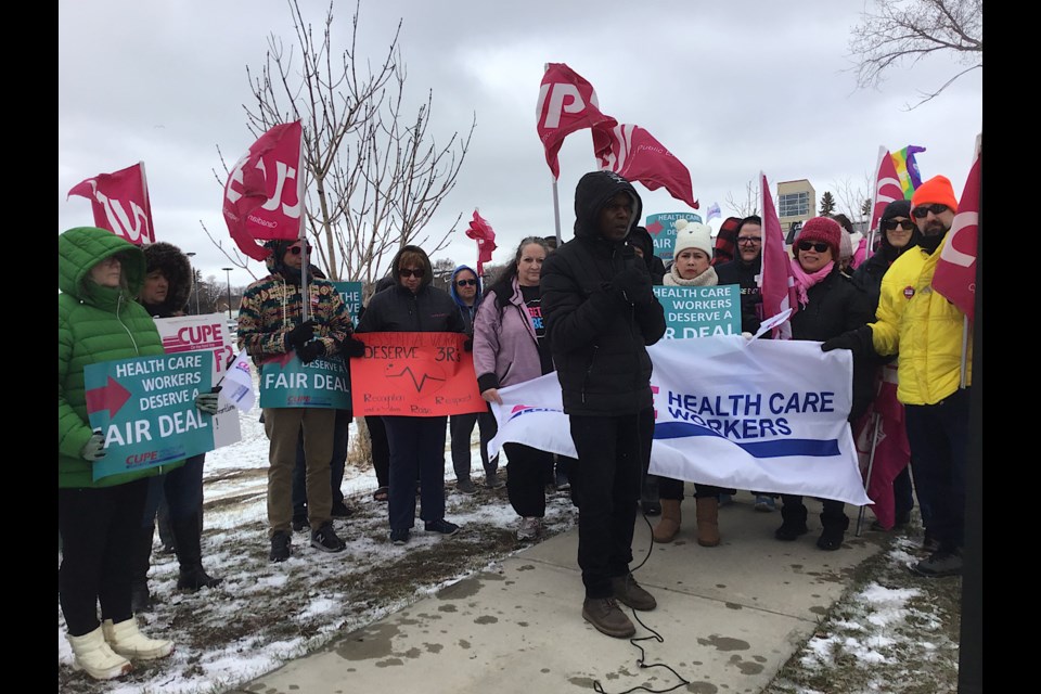 CUPE 5430 President Bashir Jalloh speaks at a rally of CUPE health care workers outside Pasqua Hospital on April 19.