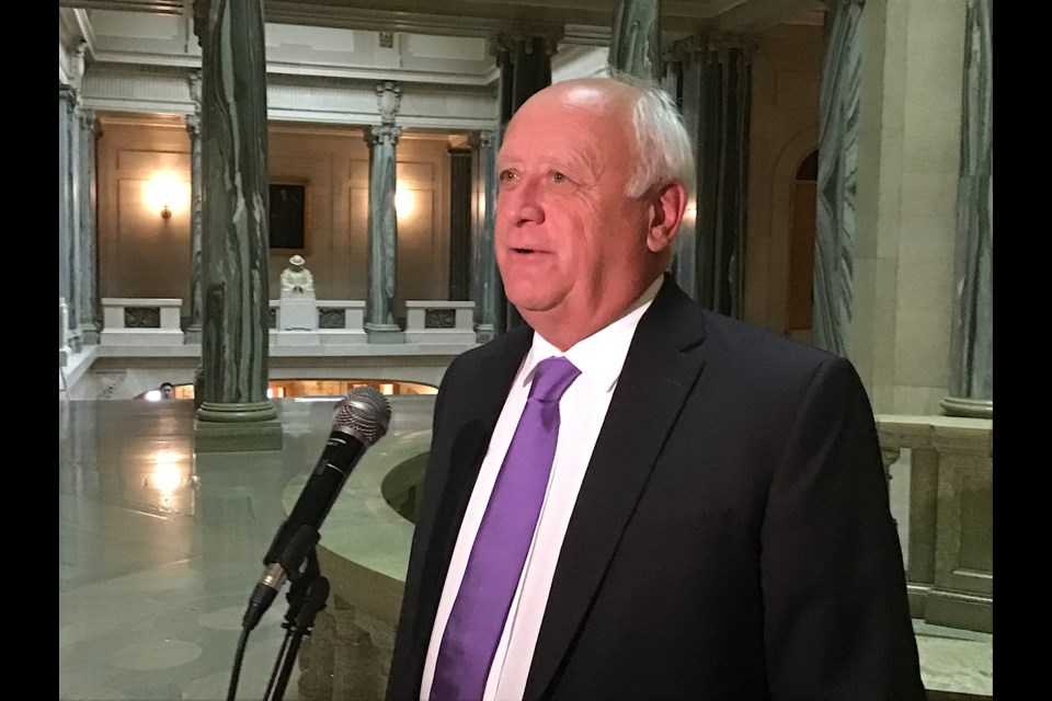 Agriculture Minister David Marit seen speaking to reporters Aug. 21 at the Legislature on drought relief to livestock producers.