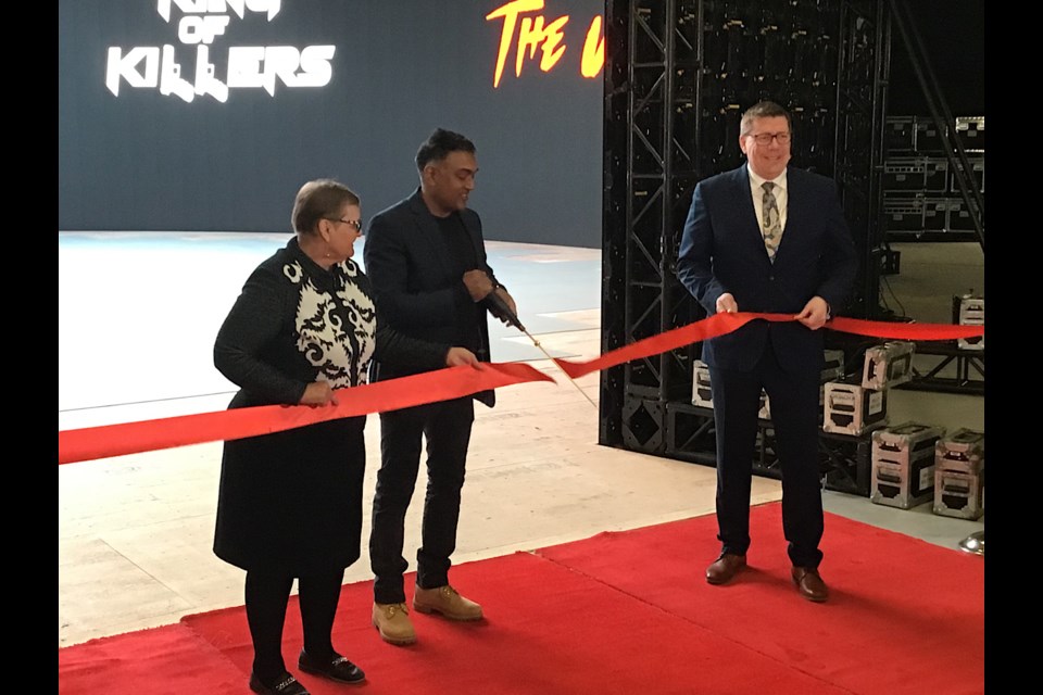 Premier Scott Moe, right, and Parks, Culture and Sport Minister Laura Ross, left, joined independent producer Anand Ramayya of Karma Film, centre, to cut the ribbon on the LED Volume Wall.