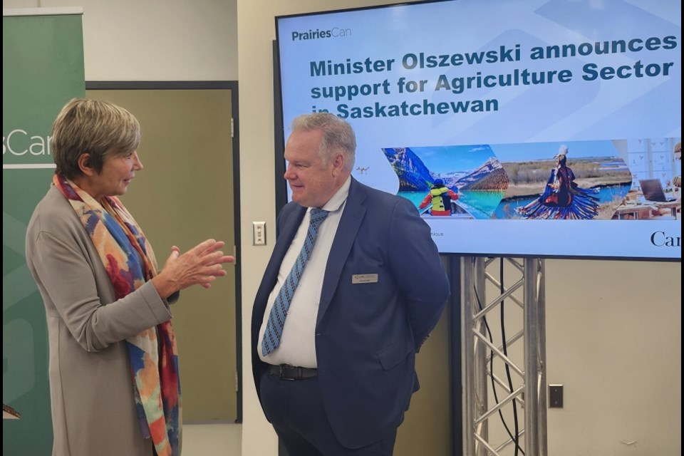 PrairiesCan Minister Eleanor Olszewski, left, talks with Global Institute for Food Security Executive Director Dr. Steven R. Webb after the announcement of a $4.2-million investment on Tuesday, Aug. 12. 