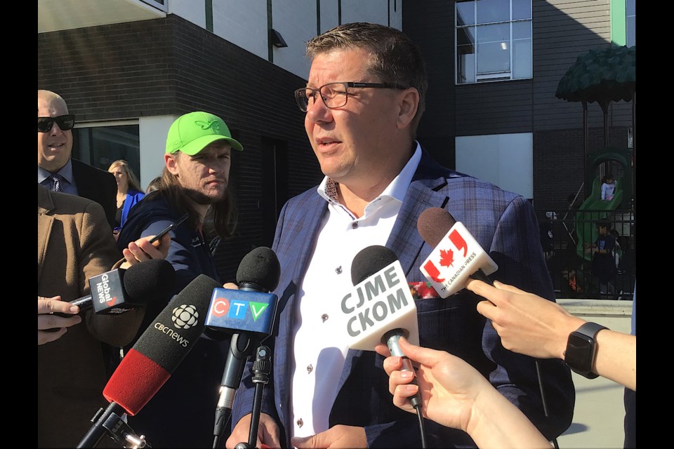 Premier Scott Moe speaks to reporters at a schools opening in Lakeview Sept. 25.