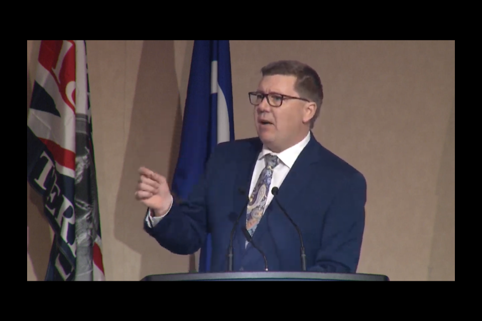 Premier Scott Moe is seen addressing the 2023 SUMA convention in Saskatoon.