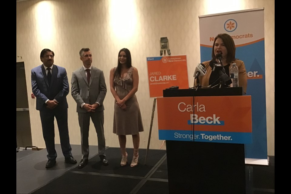 Carla Beck and the NDP candidates Noor Burki, Jared Clarke and Kaitlyn Stadnyk celebrate at their election night headquarters in downtown Regina.