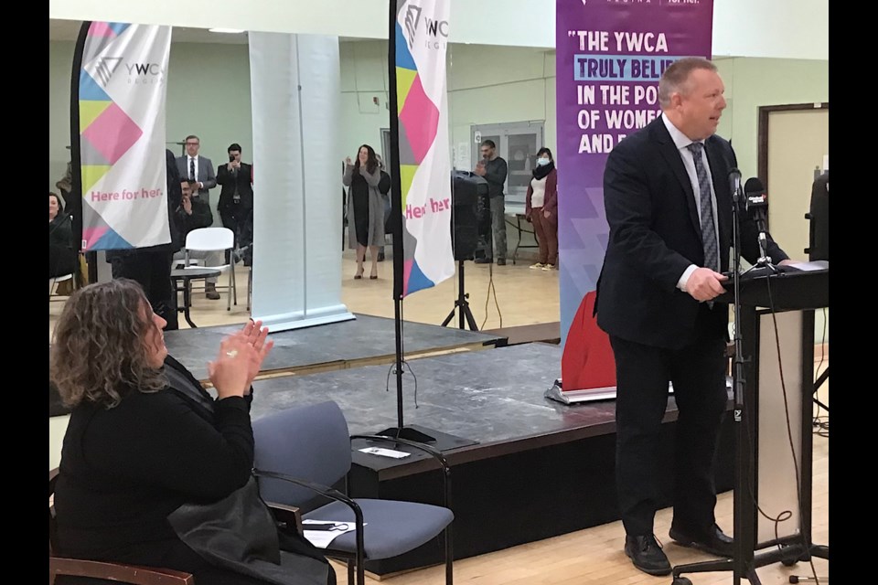 Minister for Sask Housing Corporation Gene Makowsky makes the announcement of an additional $3 million to the YWCA Centre for Women and Families project. 