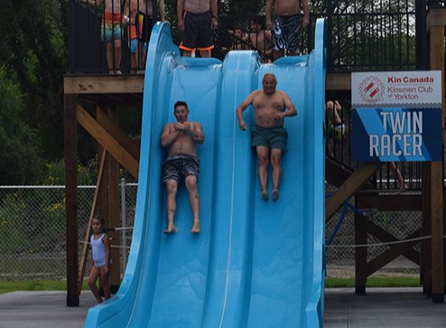 For the ceremonial first splash at the new Canora Aquatic Park, Mayor Mike Kwas, left, and Canora Pelly MLA Terry Dennis went flying down the side-by-side Twin Racer slides.