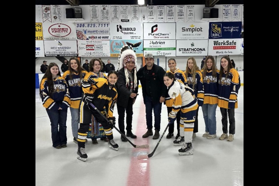 Chief Evan Taypotat and Tyson Wuttunee drop the puck for the game between the WP Thunder and Warman Wildcats.