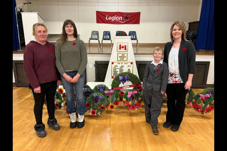 Laying multiple wreaths at the Preeceville Remembrance Day Service, from left, were: Laura Roelens, Lydia Roelens, and Will and Leah Prestie.