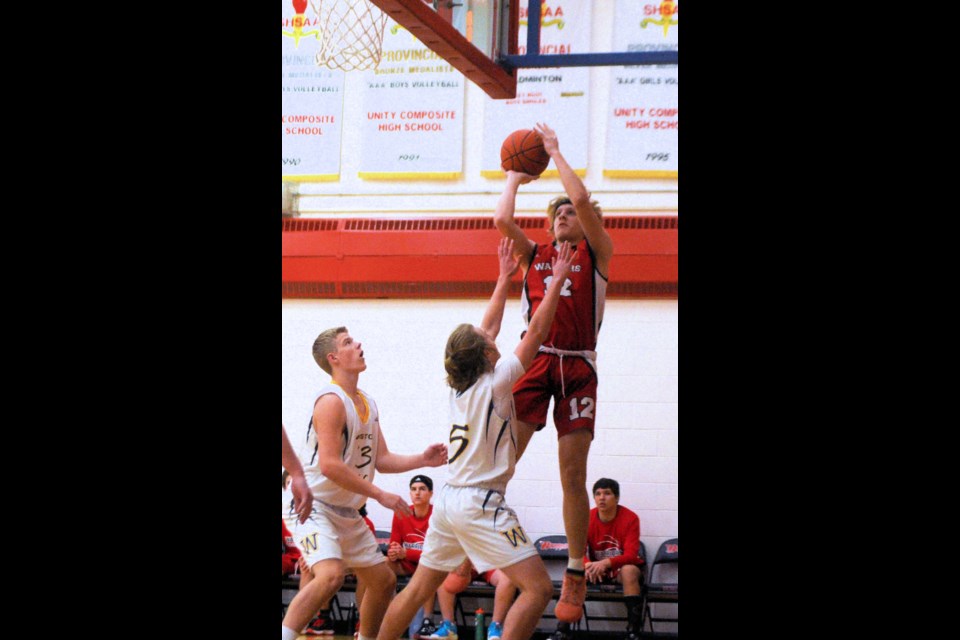 Unity’s Ethan Stifter goes up to make a shot in the senior boys’ regional final March 18 in Unity. The Warriors won the game 79-57, advancing them to Hoopla, where they will meet Osler Vally Christian Academy in the provincial semifinal.