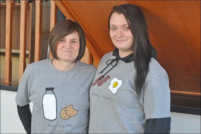  Pastor Deb McNabb and JP II student Allysa Woodrow teamed up to bring students and seniors together as part of the Better Together program. McNabb and Woodrow wear shirts associated with the project. Their initiative is now being undertaken by students at UCHS. (File photo)