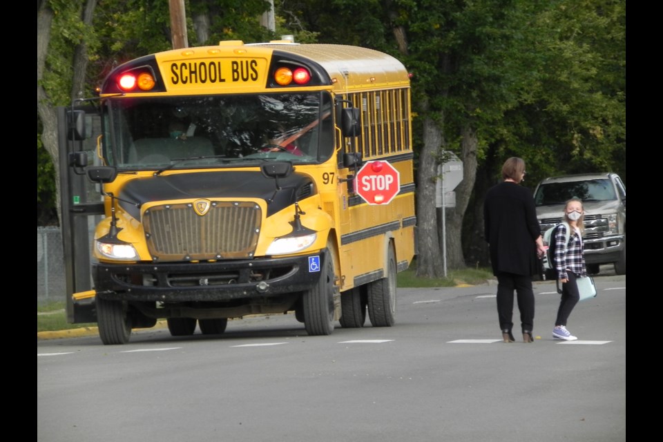 UPS Principal, Karalyn Brown, helps direct students coming off buses on the first day of school, Sept. 1                 