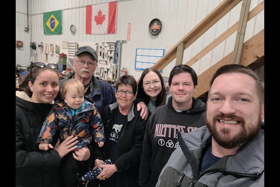 The Simon family gathered to take a picture 16 days after Brennan (second from right) woke up from a coma. Brennan has been diagnosed with auto-immune encephalitis.