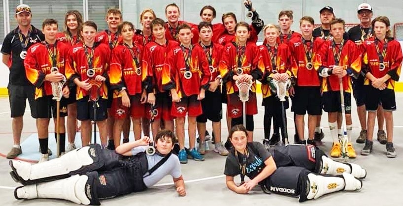 The U14 athletes and coaches from Weyburn Lacrosse gathered after winning silver at the box lacrosse provincials.