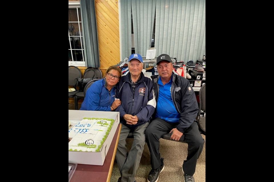 From left to right, Helene Cote, Scotty Cote and Cal Cote gathered in front of Scotty’s birthday cake.