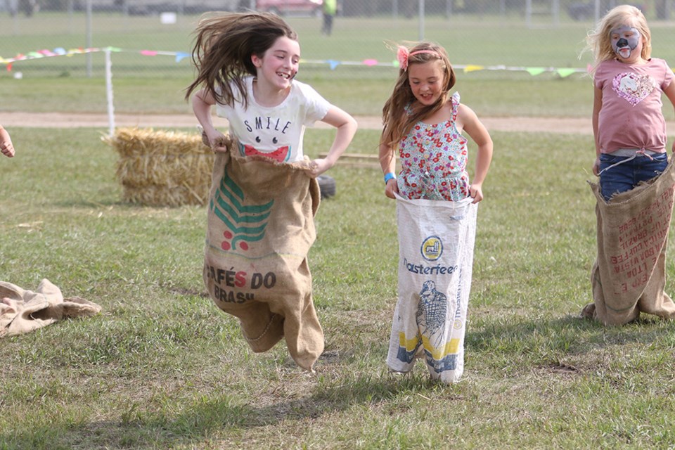Rayna Edison and Riley Roberts compete in the sack race at at Canora Ag Days on Aug. 27.