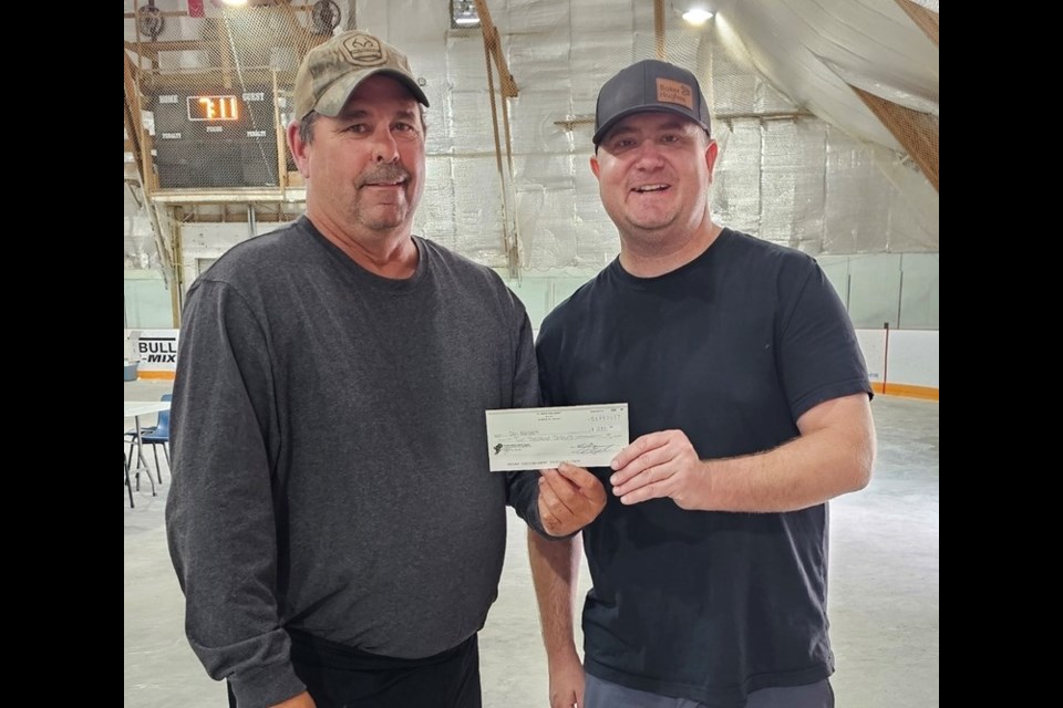 Chris Farnden, right, presented top prize to Don Norbet, who came in first in the adults' division and also caught the longest fish. 