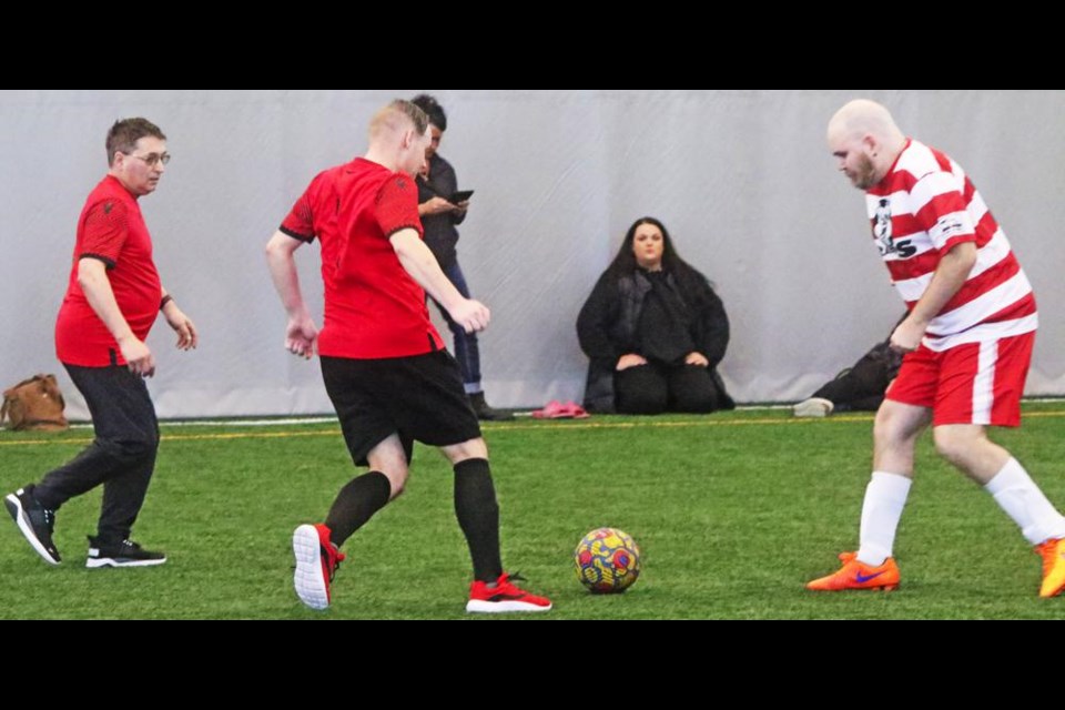 Two Weyburn players moved the ball to the Regina zone, during a fun game on Sunday in Weyburn