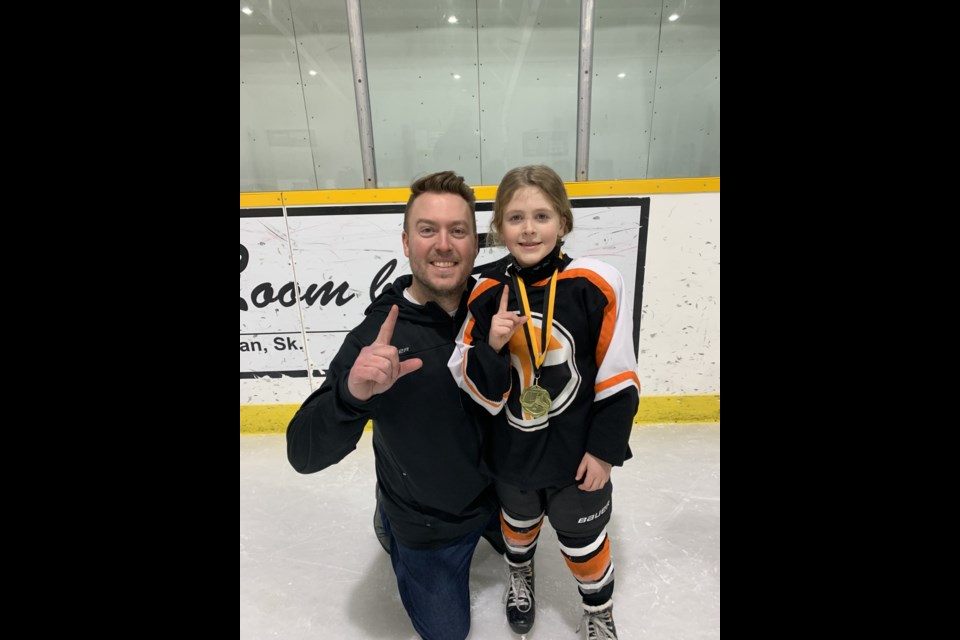 Evan Johnson, pictured here with his daughter, is the head coach of a brand new U9 all girls hockey team, the Yorkton Lions Club Terriers.