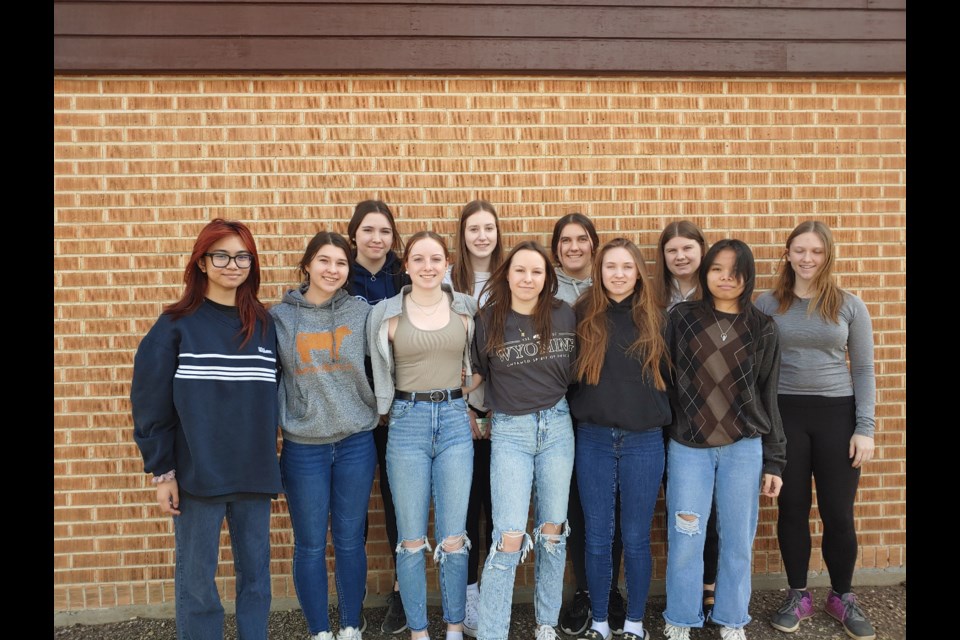 Members of the Assiniboia Composite High School Rockets girls basketball team gather for a team photo. In the back row, from left, are Khanesia Warken,  Jenne Gronsdahl, Sydney Huys, Jayla Huys and Nikki Beaubien. In the front row, from left, are MJ Villanueva, Keyara Peterson, Shaina Gee, Keanna Gee, Faith Kwasnicki and Kian Tolentino. Missing were Kayley Beaubien, Jessica Beaubien, Diya Viran and Jhanna Williams.