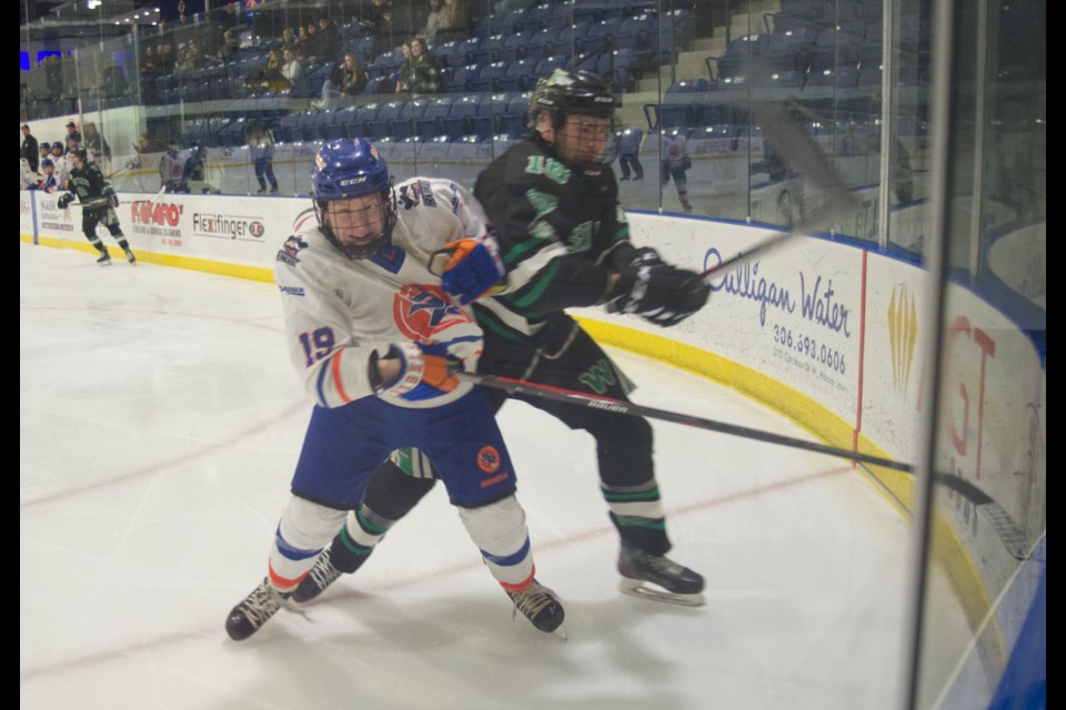 Jordan Johnson fights for the puck during the Richardson Pioneer 鶹Ƶern Rebels game against the Saskatoon Westleys. 