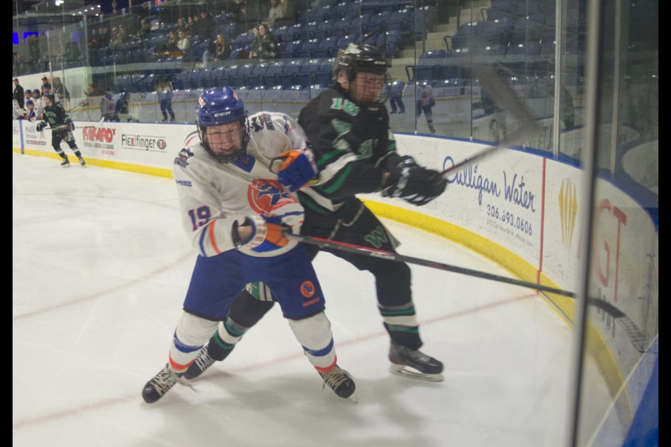 Jordan Johnson fights for the puck during the Richardson Pioneer Southern Rebels game against the Saskatoon Westleys. 