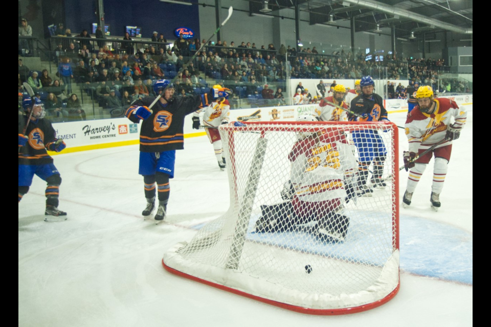 鶹ýAVern Rebels player Chase Tenetuik (at left) celebrates after scoring late in the third period.