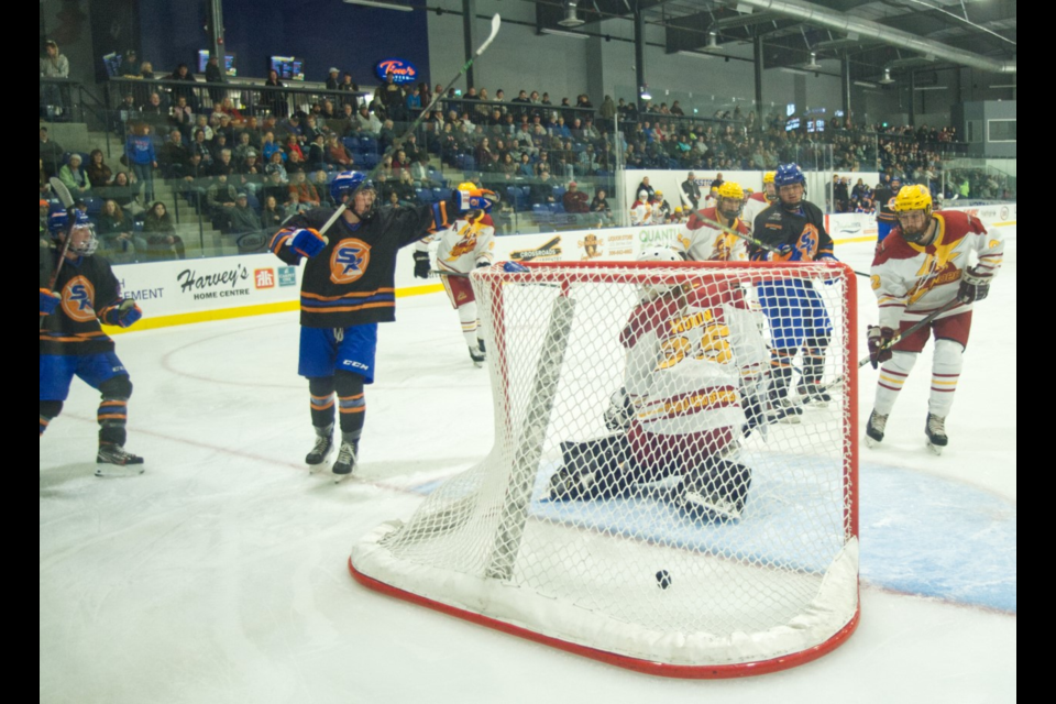 Southern Rebels player Chase Tenetuik (at left) celebrates after scoring late in the third period.