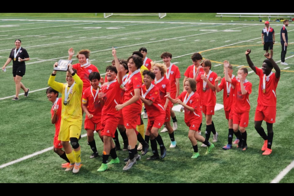 The Astra Blue U15 boys team celebrate after beating QC United in the finals. 