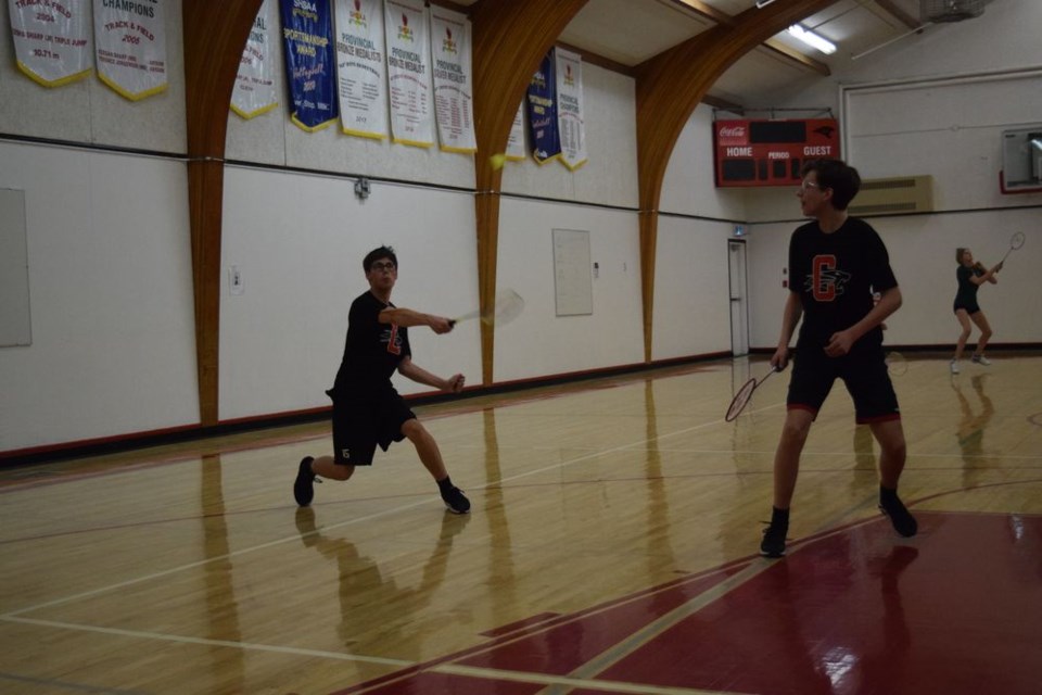 At the junior badminton tournament held at Canora Composite School on April 12 Tucker Mydonick hit a smash across the court while teammate Connor Kraynick closely watched the action. 