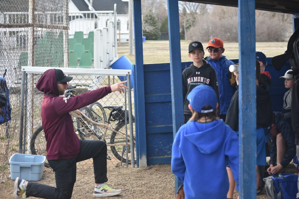 Bryce Ehrhardt, left, took charge at the Coach’s Box, providing invaluable guidance to budding talents, including, from left, Anna Reilkoff, and Silas Guillet in the U11 category. Their dedication and focus were evident as they absorbed Ehrhardt's coaching, honing their skills for the season ahead.