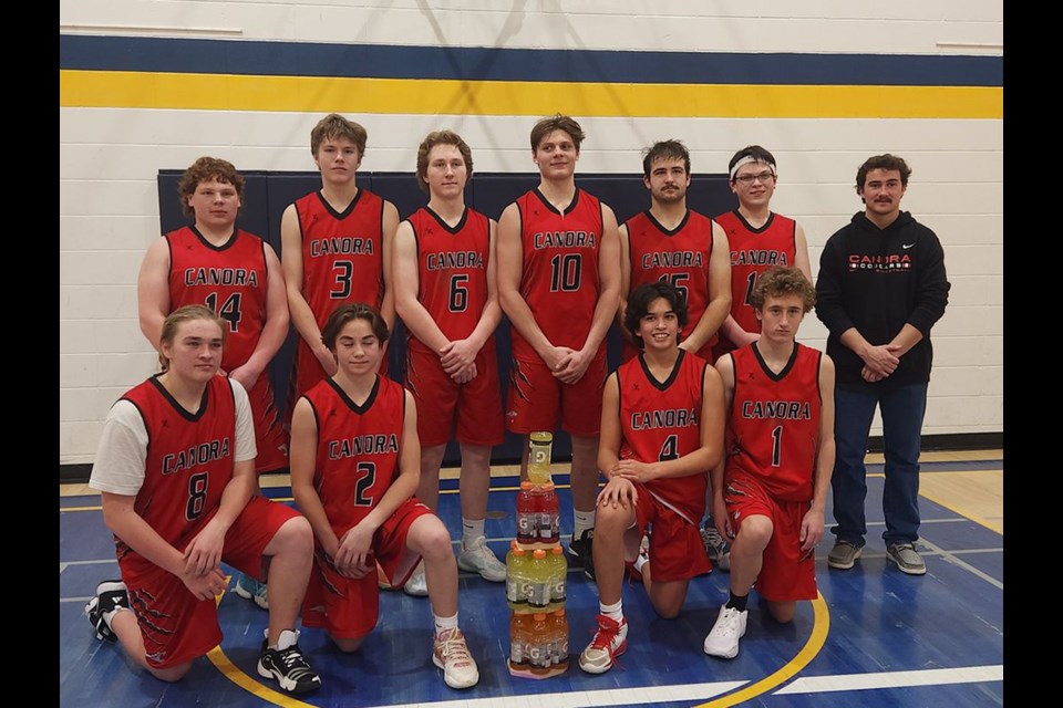 The Canora Composite School Cougars senior boys basketball team won the tournament at the Norquay School East Central Clash on Jan. 5-6, and were awarded the championship trophy, made of Gatorade bottles. From left, were: (back row) Jordan Makowsky, Linden Roebuck, Briel Beblow, Matthew Makowsky, Andrew Owchar, Josh Rock and Coach Hudson Bailey; and (front) Serin Crane, Jackson Paligan, Liam Trask and Andrew Sliva.
