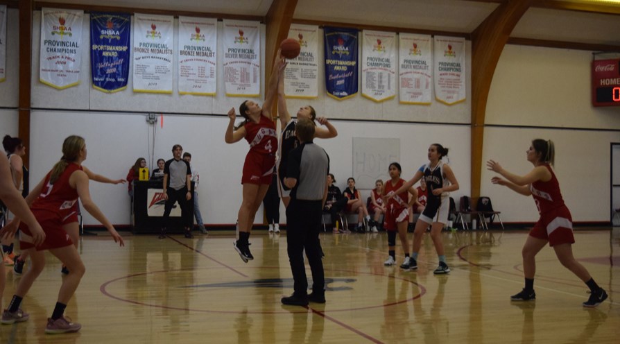 At the senior girls basketball tournament hosted by the Canora Composite School Cougars girls’ team on Feb. 11, Zoe Thomas of the Cougars (left) won the opening tip in the first game against Langenburg. Other Canora players in the photo, from left, were: Sofia Tratch, Methyl Trask and Robin Skurat.