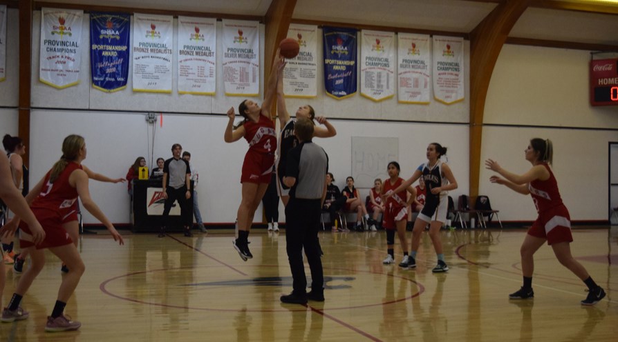 At the senior girls basketball tournament hosted by the Canora Composite School Cougars girls’ team on Feb. 11, Zoe Thomas of the Cougars (left) won the opening tip in the first game against Langenburg. Other Canora players in the photo, from left, were: Sofia Tratch, Methyl Trask and Robin Skurat.