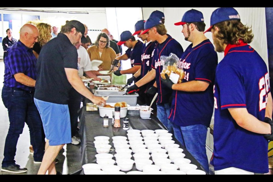 The Weyburn Beavers players served up the food at the sports dinner on Friday, where John Gibbons was the guest speaker.
