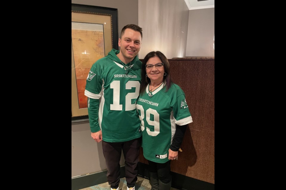 Caroline Saxon with Saskatchewan Roughriders kicker Brett Lauther, who was invited to a private fan get-together at Craves and mingled with about 25 fans, signing photo cards and taking pictures. 