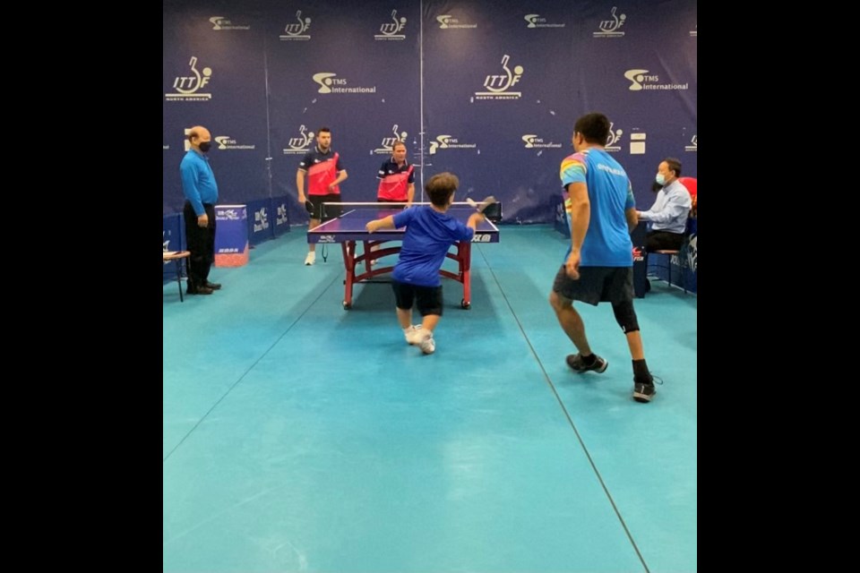 Carter Morrison in doubles action at the table tennis tournament. 

