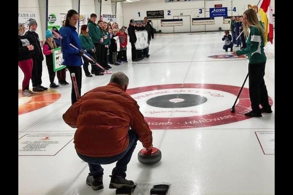 Mayor Marcel Roy threw out the ceremonial first rock for the Provincial 4-H Curling championships, with the rock swept by 4-H Saskatchewan ambassadors Madeline Christiansen and Keira Hawreluik